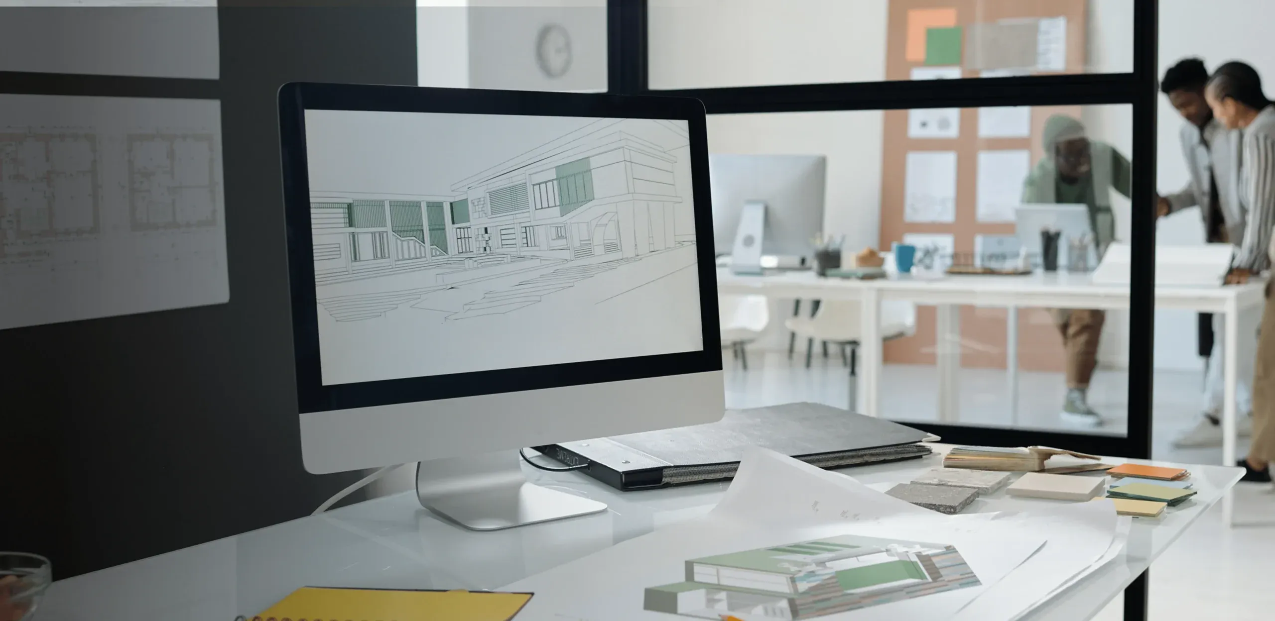 Design studio desktop with plans