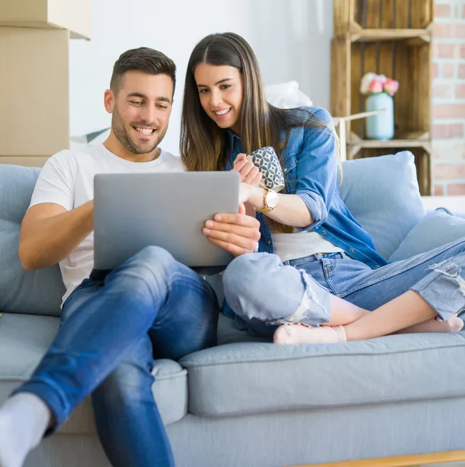 Couple looking at laptop